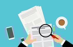 Manager reviewing employee performance report